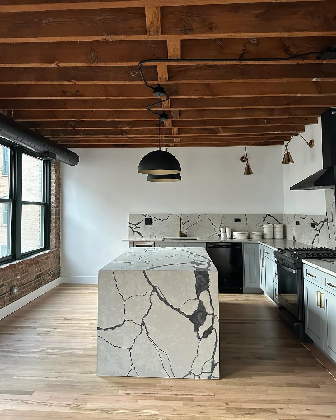Loft Kitchen Marble Makeover — Calacatta Marble Waterfall Island kitchen project by Indiana Stone Gallery